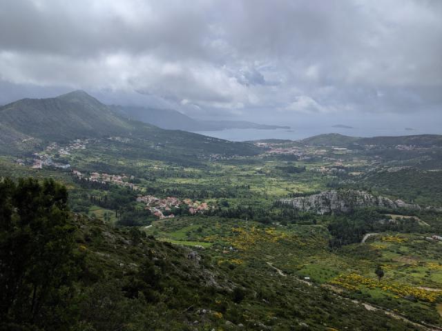 Wide, green valleys with hills on all sides