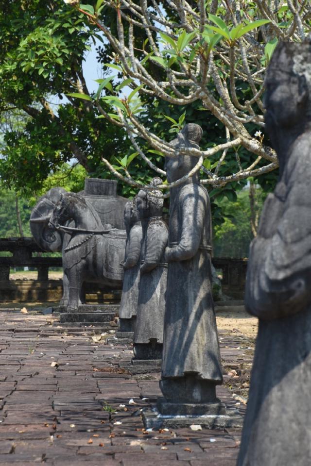 Stone figures in front of the tomb